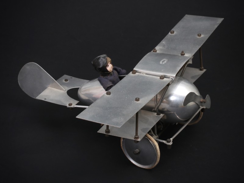En vente :  AUTOCYCLE AERONEF BIPLAN  ALUMINIUM 1930 ET SON RARE PILOTE TETE PORCELAINE